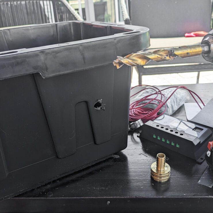 drilling a hole in a plastic utility box