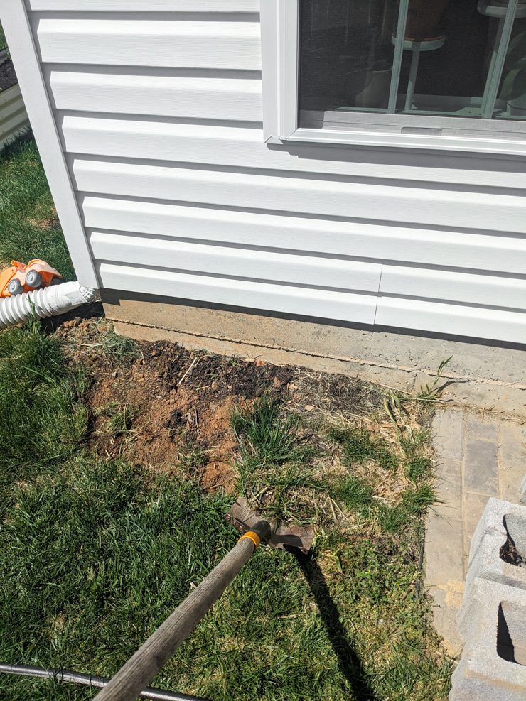 leveling the ground for the rain barrel