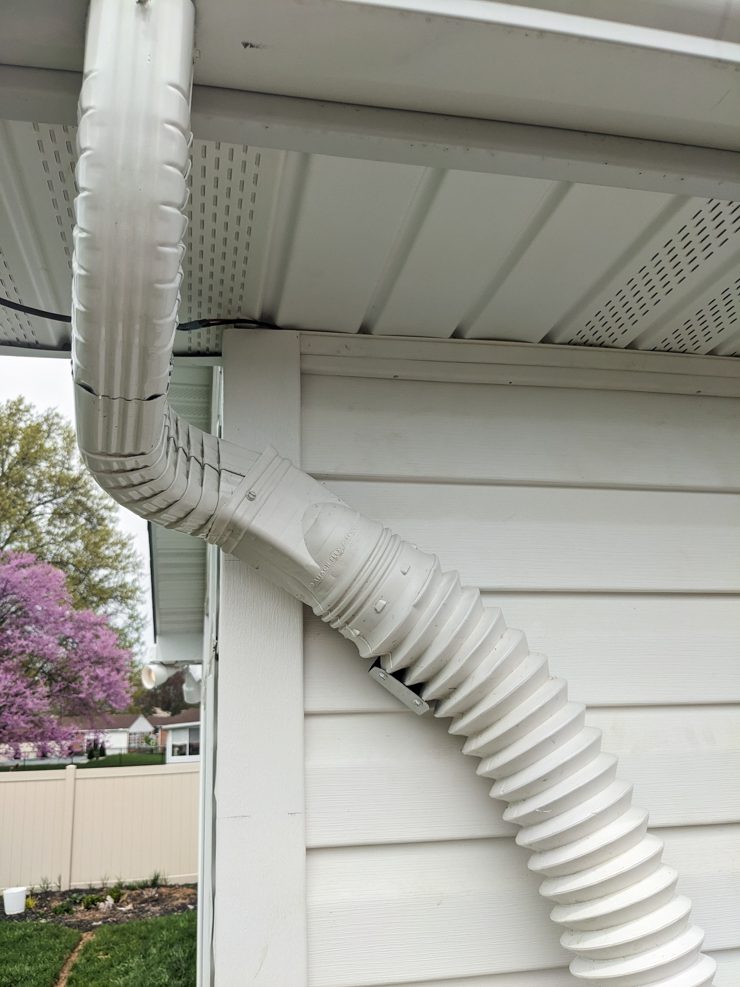 attachment to divert water from the gutter to the rain barrel