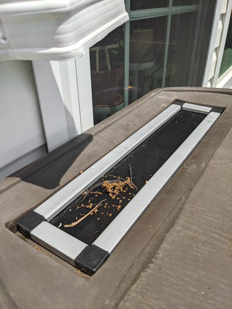 screen on top of a rain barrel