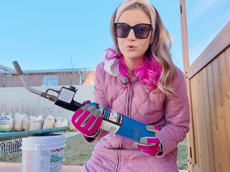 woman holding a propane torch
