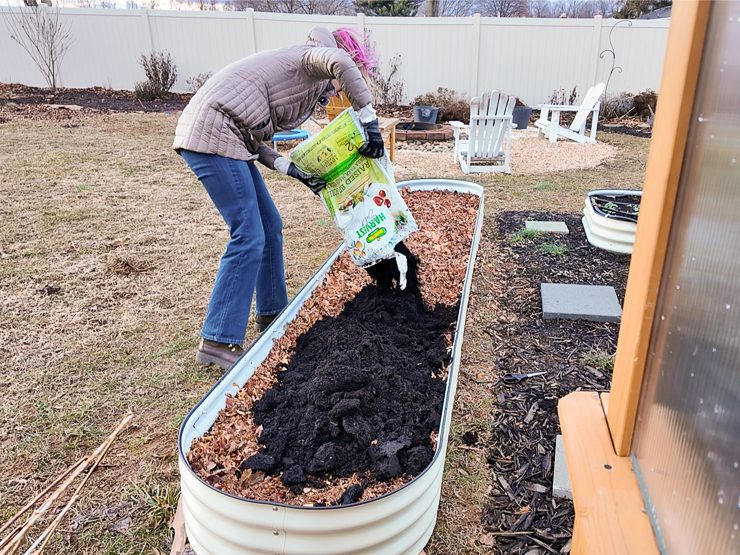 filling the bed the rest of the way with soil