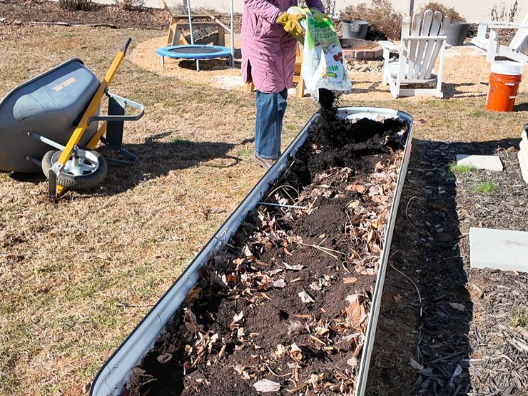 filling a raised bed with soil