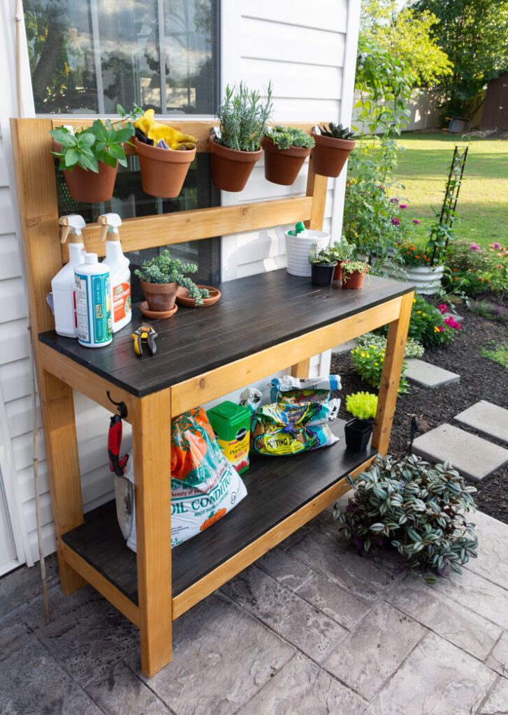 beautiful DIY potting bench on a patio