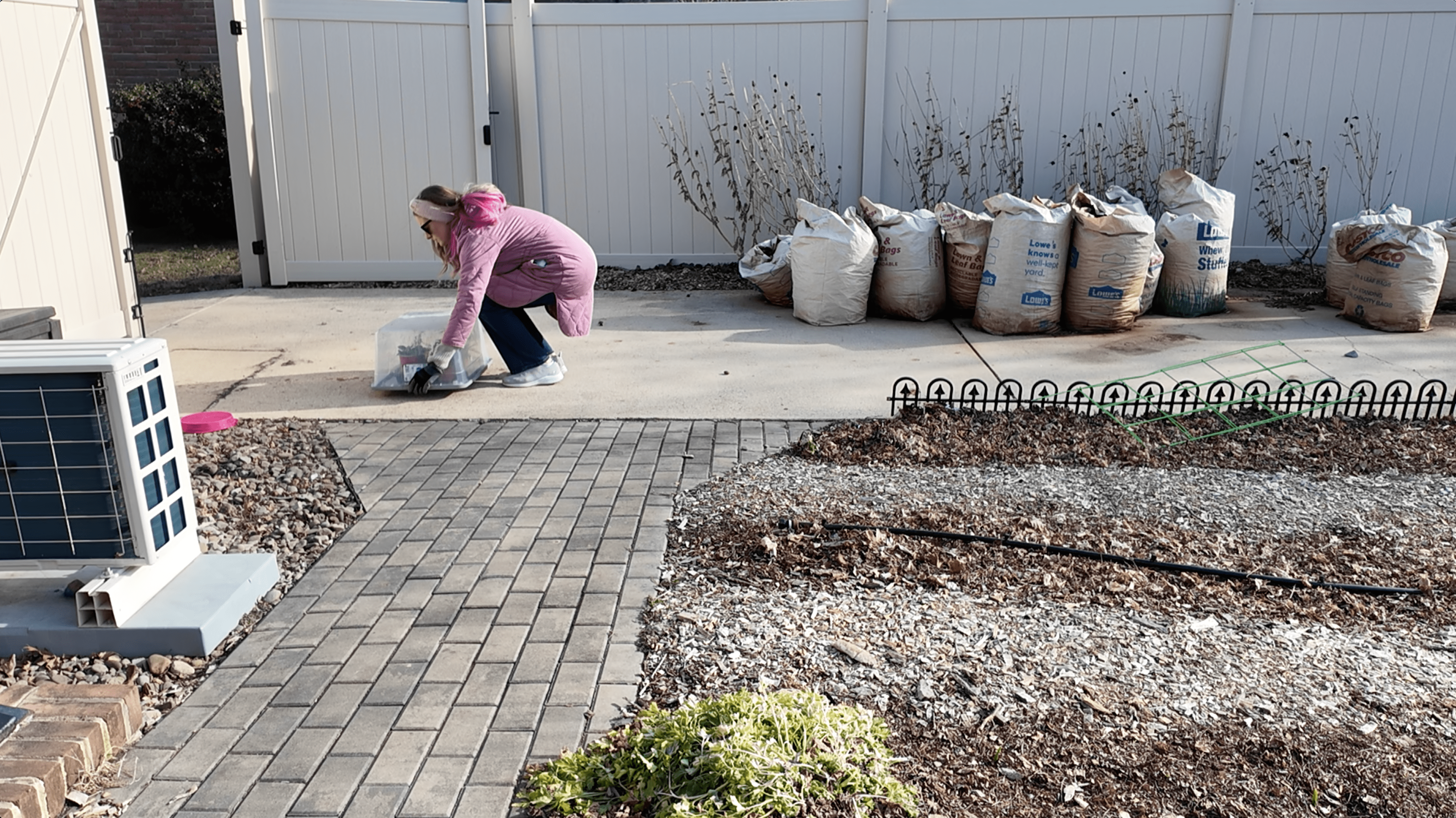 setting a storage bin down outside