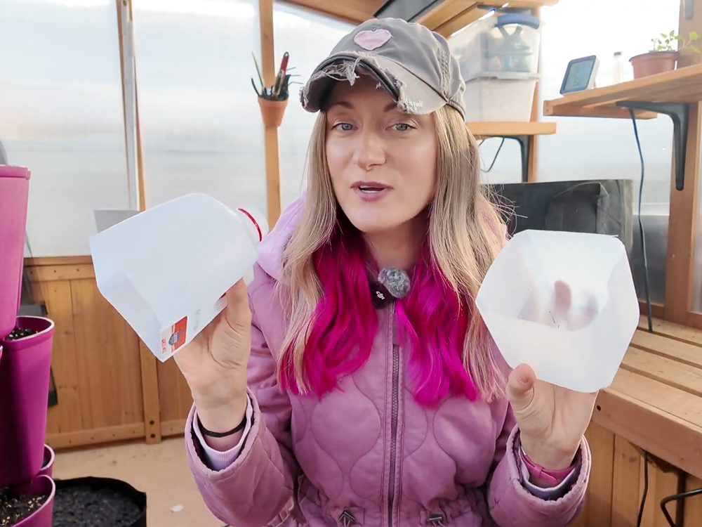 women holding a plastic jug cut in half